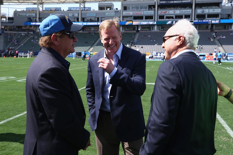 Chargers owner Dean Spanos, NFL Commissioner Roger Goodell, and Eagles owner Jeffrey Lurie on a field before a game